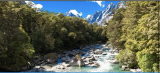 High mountain plateau creek amidst mountain peaks and lush forest.