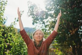 Birthe Kaarsholm doing Self-Breema in the garden
