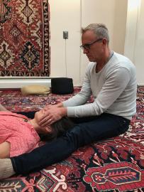 Practitioner doing Breema bodywork with a recipient at the Breema Center