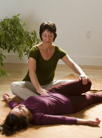 Laura Rawson practices Breema bodywork with a recipient