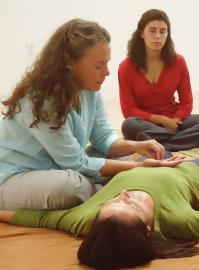 Denise Berezonsky demonstrates a Breema bodywork sequence in class