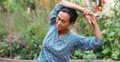 Alexis Mulhauser practicing Self-Breema in the garden