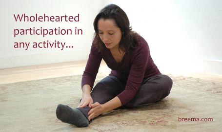 Salena Irion practicing Self-Breema exercises on the floor