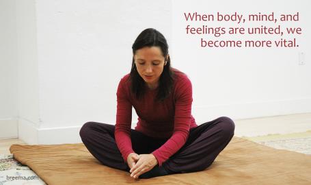 Student practicing Self-Breema exercises on a padded floor