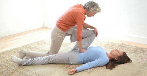 Students giving and receiving Breema bodywork in a mutually supportive setting