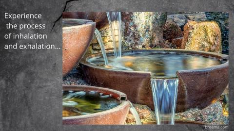 Water trickling down a fountain made of bowls.