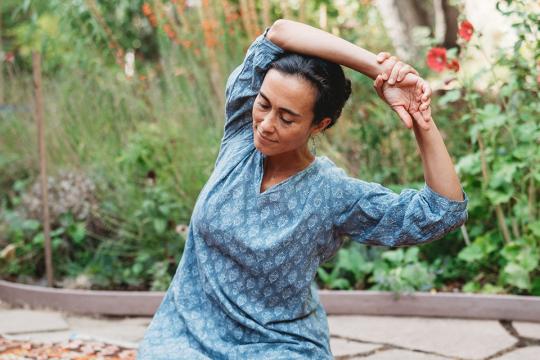 Alexis Mulhauser practicing Self-Breema in the garden